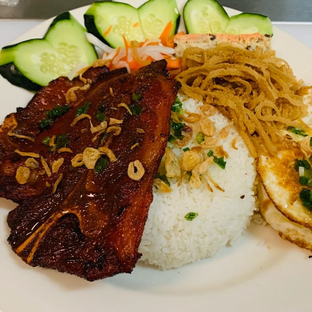 65. Đặc Biệt - Grilled Pork Chop, shredded Pork Skin, Pork Loaf, & 2 Eggs.